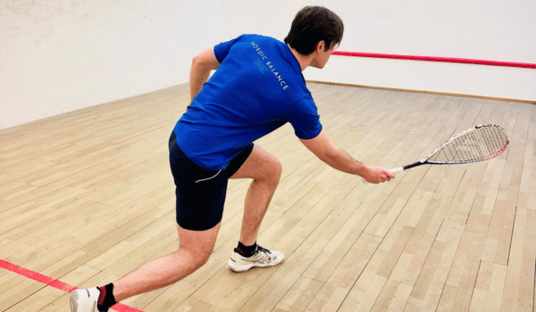 Squash Coach Christian Grandi playing on Nordic Balance St James's Court in St James's london